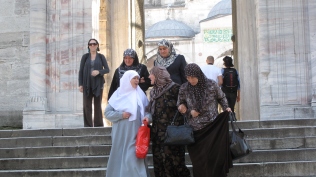 Women wearing hijab, leaving Mosque, carrying Esprit bag...East meets West